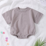 Barboteuse à manches courtes en coton biologique – Douceur et confort pour bébé